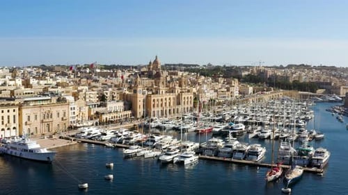 Birgu Malta Waterfront With Yachts Moored In The Marina - aerial drone shot