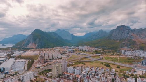 Aerial Video Footage From a Drone of Residential Areas Against the Backdrop of Mountains