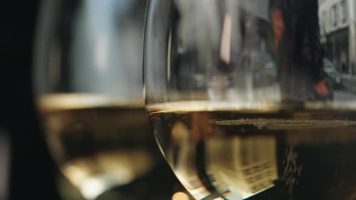 Closeup view of multiple wine glasses with champagne degustation at a French restaurant. Blurred bac