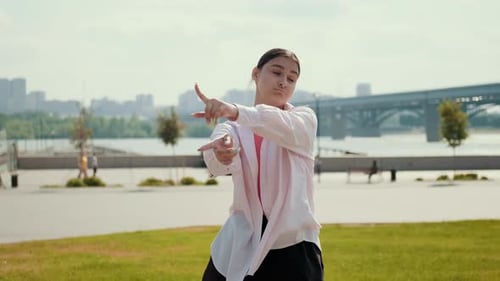 Girl Dancer Dancing Energetic Dance on the Street in Urban Atmosphere