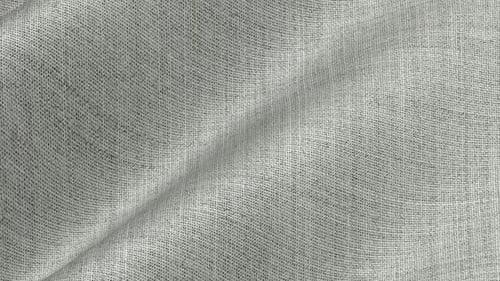 Hellgrauer Hopsackstoff aus Fresco Wool, der sich in klaren, atmungsaktiven Wellen aus offenem Gewebe kräuselt