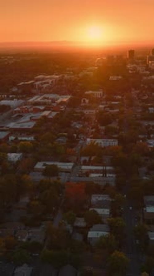 Bright setting sun over the big city. Sacramento panorama at sundown