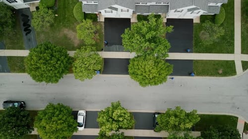 Aerial Top View of Driveway Sealcoating Pavement Near Private Houses in the Suburbs