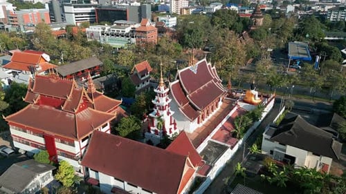 Exterior Of Wat Rajamontean With Pagoda And Giant Buddha Sculpture In Chiang Mai, Thailand. aerial s