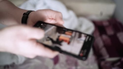 Man scrolling social media in smartphone