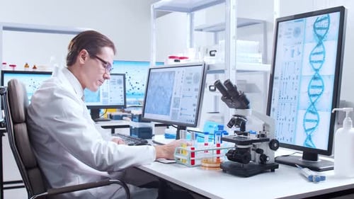 Scientist Working with Test Tubes in Laboratory