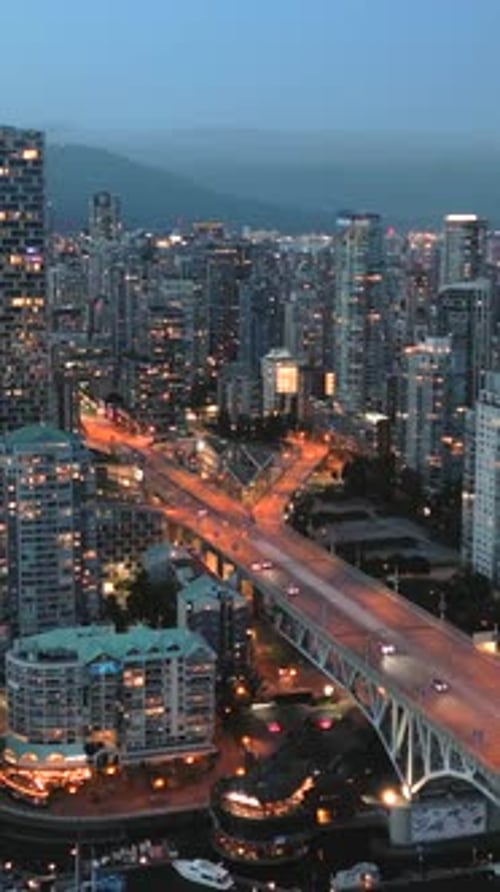 Downtown of Vancouver at Night Skyscrapers and Traffic on the Roads