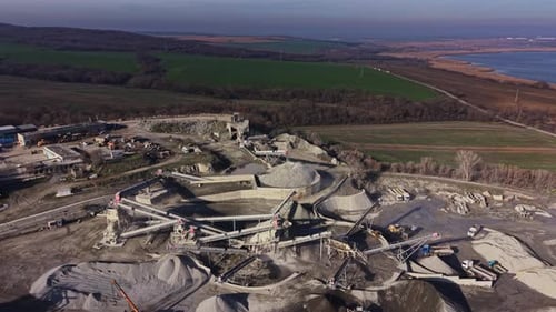 Mining operation in a quarry near the coast capturing industrial activity