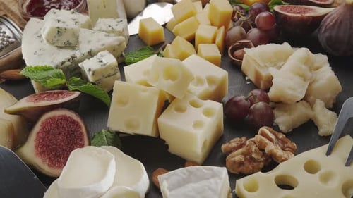 Cheese Assortment with Figs, Nuts, and Grapes