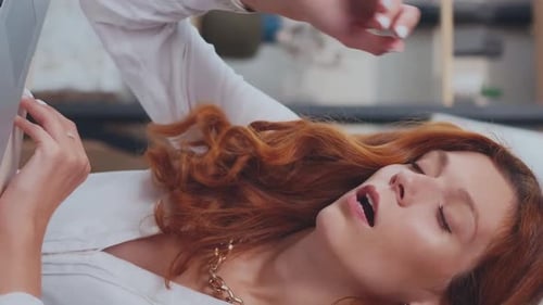 Young Frustrated Caucasian Woman Manager Works with Laptop Sits in Office