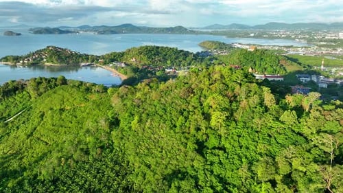Aerial shot of green mountains and ocean views.