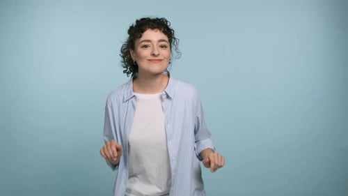 Young Curly Haired Brunette Woman 20s Years Old Wear Blue Shirt Dance Fool Around Have Fun