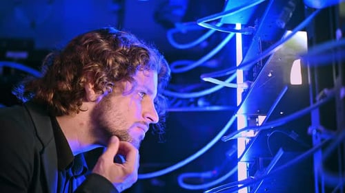 Man analysing servers in a data center