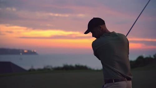 Sports Man at Golf Course Playing Game in Nature and Hitting Ball with Club