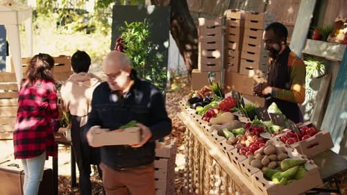Customer Buying Fresh Produce at Farmers Market