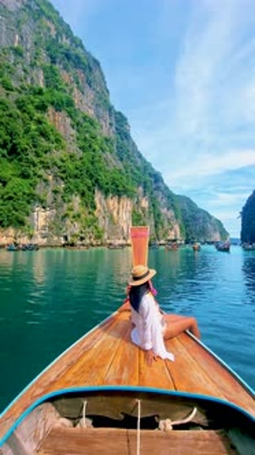 Pileh Lagoon with Green Emerald Ocean at Koh Phi Phi Thailand Women in Front of Longtail Boat
