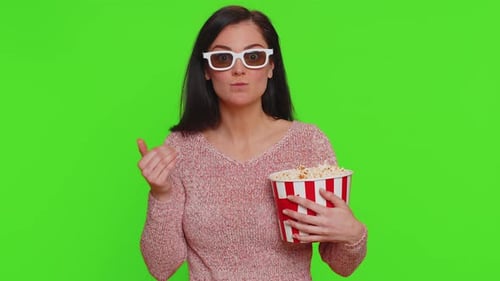 Woman With Popcorn Bucket Enjoying Movie