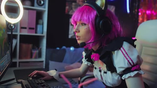 Girl Talking To Teammates While Playing Video Game