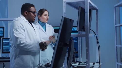 Scientists Analyzing Data in Modern Laboratory Setting