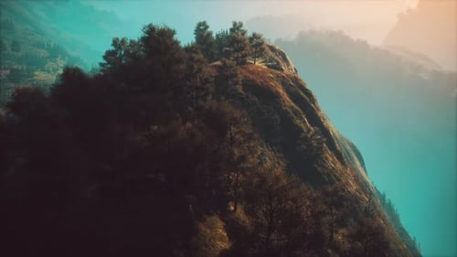 Sunset in Mountain with Green Grass and Trees