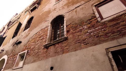 Old Venice Street With Brick Stone Facade Wall On Architectures In Italy. Low Angle