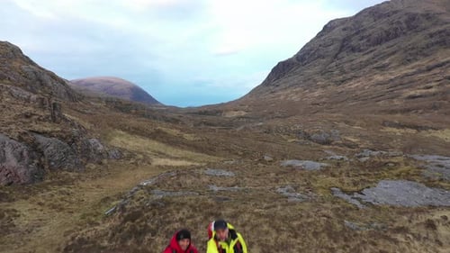 Two men hiking and exploring Highlands in Scotland