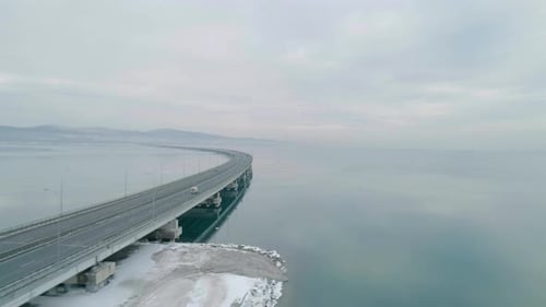 Aerial Drone View of Lowwater Bridge Across the Bay with Moving Car Active Movement of Transport