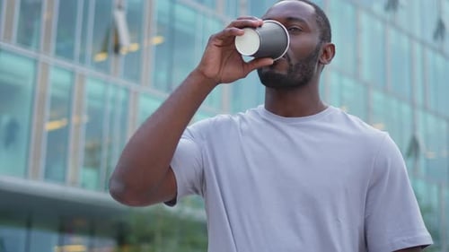 Good Morning African Man Drinking Coffee to Go Walking on Urban Downtown City Street Outdoor Man