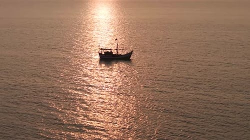 Boat on Water during Golden Hour Aerial
