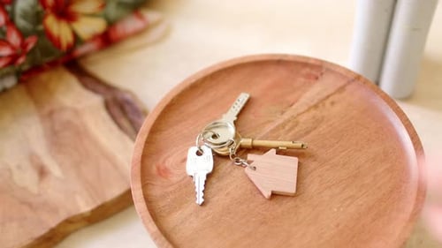 Keys on Wooden Plate with House Keychain