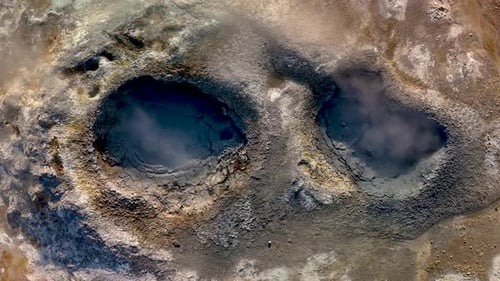 Aerial View of Steaming Geothermal Pools in Wilderness