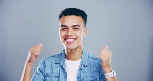 Young Man Cheering with Success