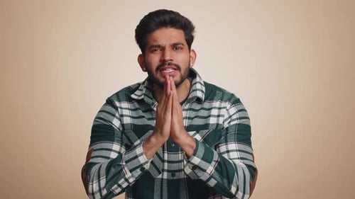 Man Pleading and Gesturing to the Camera