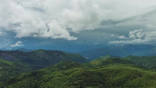 Clouds Over Summer Green Mountains