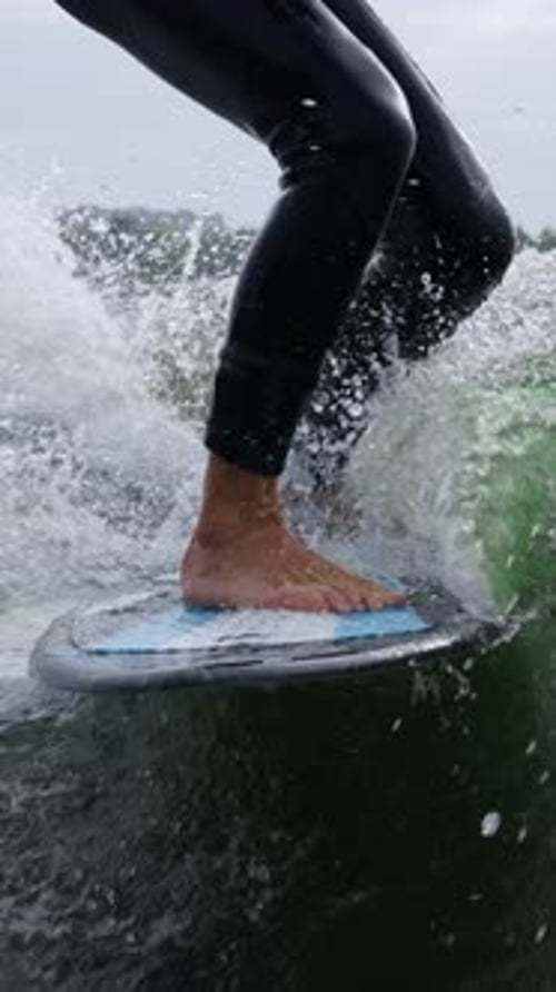 A Surfer's Journey Capturing the Thrill of Riding Waves with Perfect Balance and Skill in Two