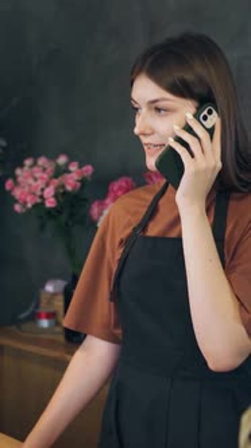Woman Uses Microphone Phone to Communicate with Flower Shop Through Floral Gestures A Call From a