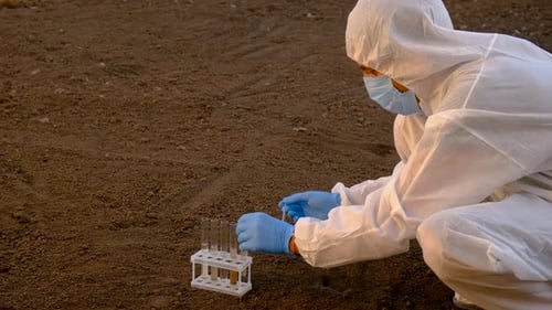 Scientist Testing Soil Samples in Rural Setting