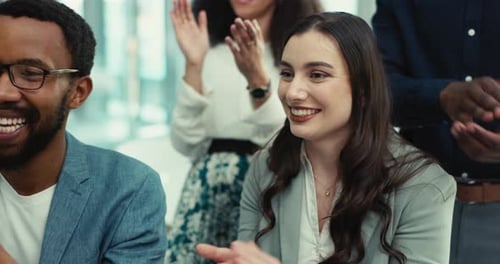 People Clapping and Smiling in Modern Office