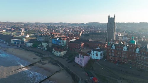 Aerial view of Cromer, Norfolk, featuring its iconic pier, beach, and historic skyline