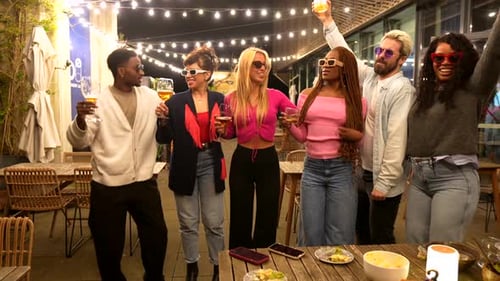 Modern People Celebrating Party Outside a Bar at Night