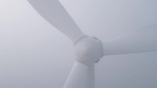 Wind Turbine Dissolves Into Dense Fog