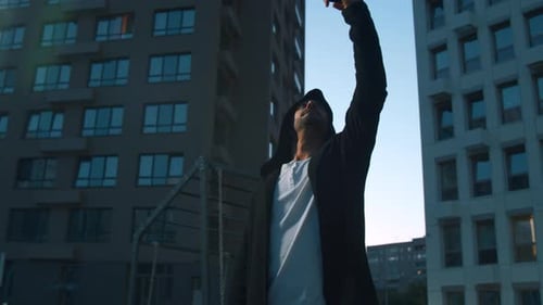 Man Using Phone in Urban Cityscape