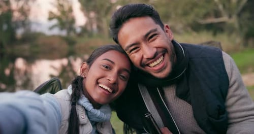 Camping, selfie and couple in nature with smile for bonding, quality time and relax in forest