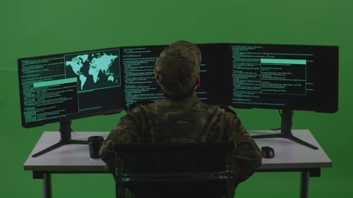 Man Soldier Developer Having Backache While Write Code With Multiple Screens In Green Screen