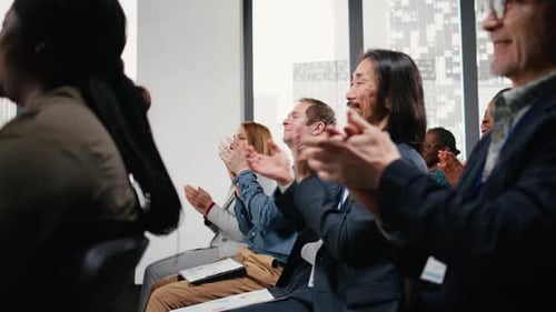 Audience of Business People Applauding at a Conference