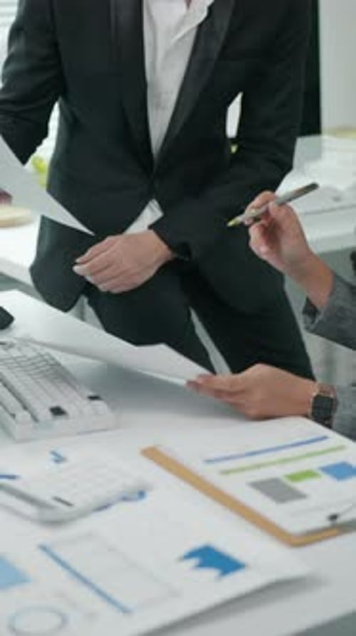 businesspeople working and brainstorming in office