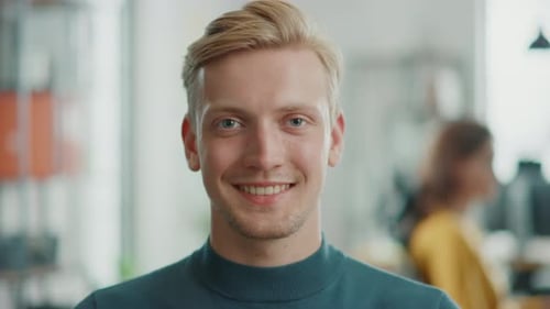 Smiling Young Man Close Up in Office