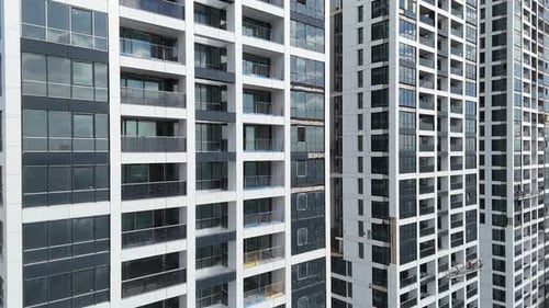 Aerial View of Skyscraper Construction with Workers Present