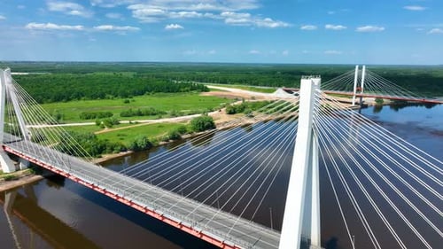 Drone shot of a modern cable-stayed bridge over a river