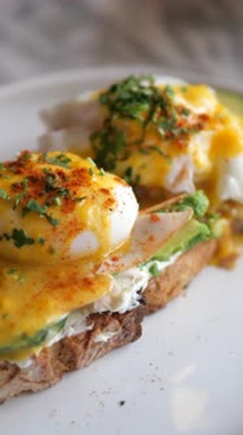 Eggs Benedict with Ham on a Plate Delicious Breakfast
